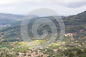 Aerial view of Biniaraix, a small village in Soller Valley surrounded by the Serra deÂ TramuntanaÂ mountains